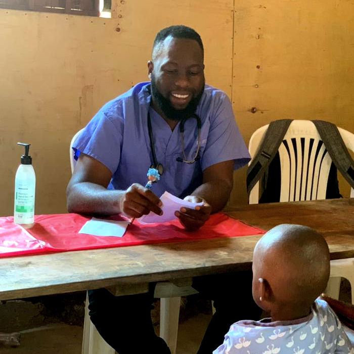 Dr. Sedrick treating a child